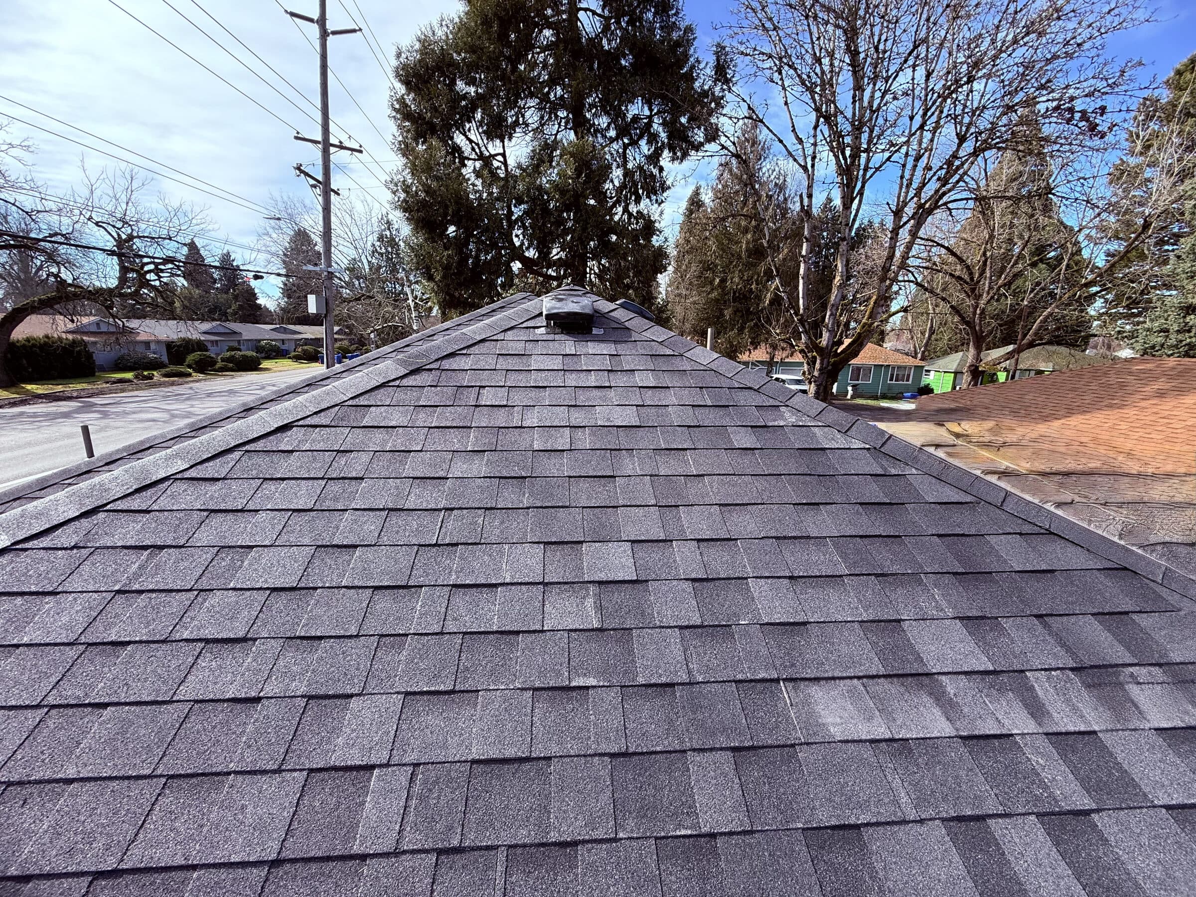Ridge view of newly installed shingle roof in Portland Oregon