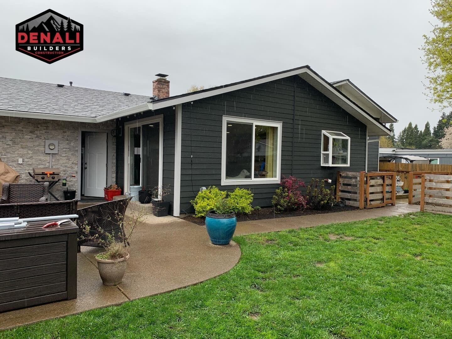 Dark fiber cement siding with white trim on Portland Oregon home by Denali Builders